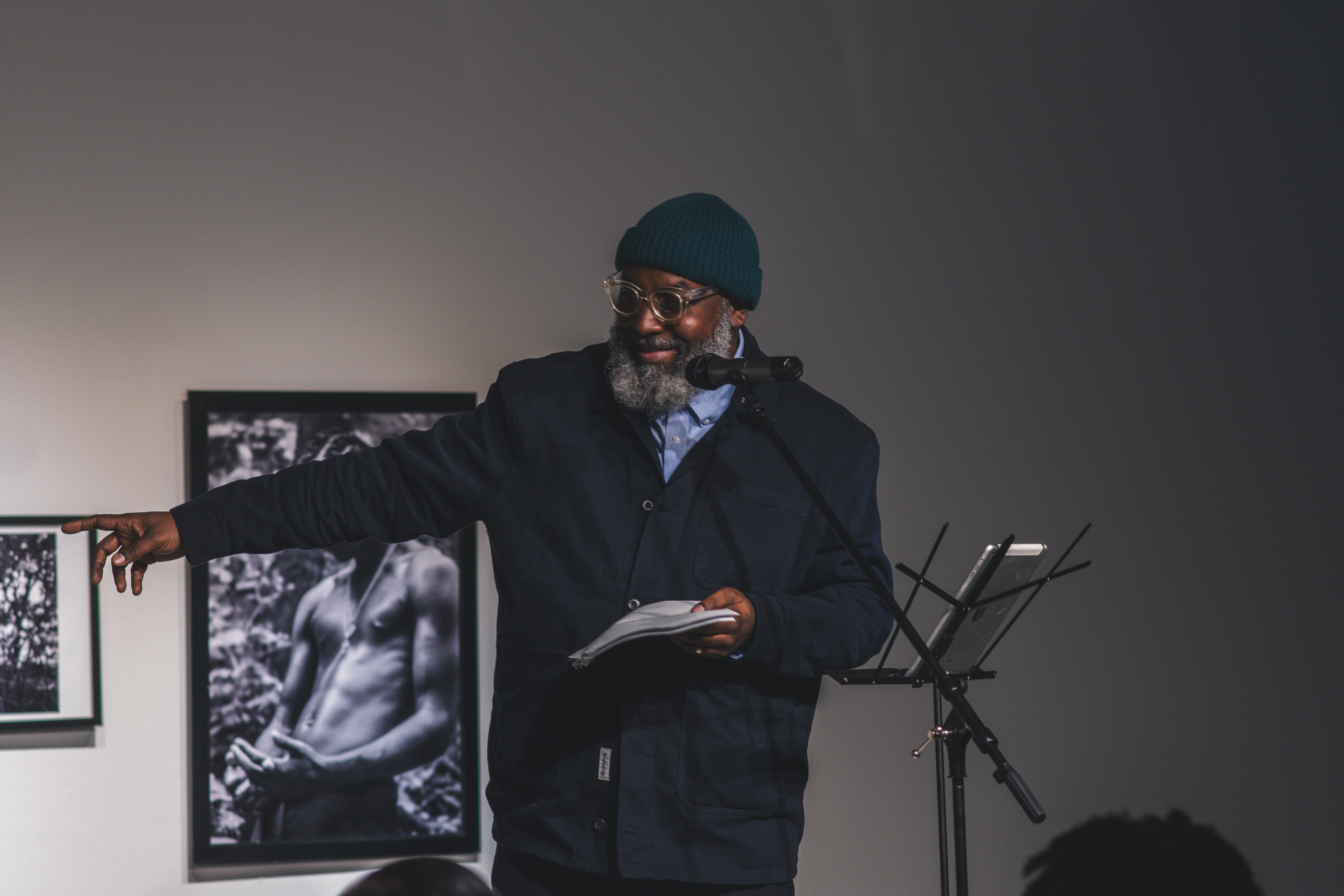 Roger in a hat performing poetry for the crowd